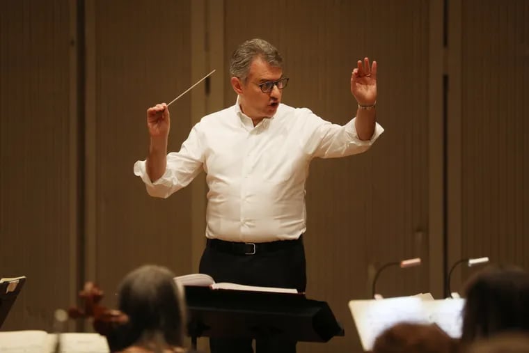 Corrado Rovaris conducts the Opera Philadelphia orchestra in rehearsal for La Boheme at the Academy House rehearsal hall Wednesday