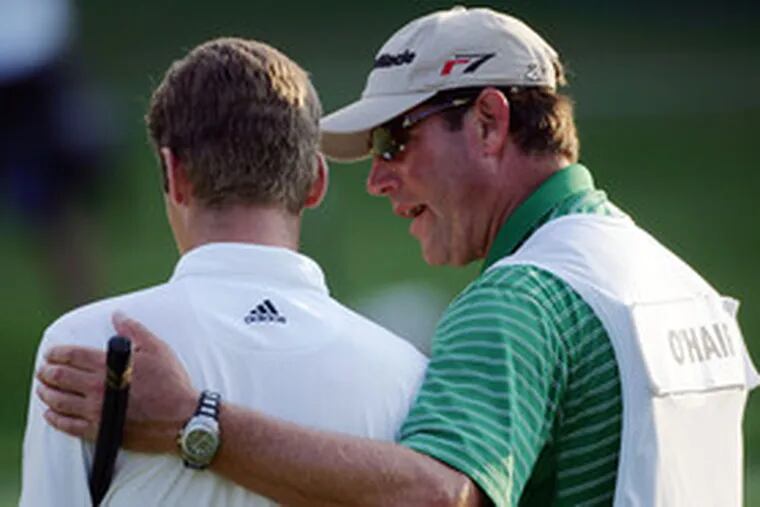 Sean O&#0039;Hair is comforted by his caddie and father-in-law, Steve Lucas, on the 18th green during Sunday&#0039;s final round.