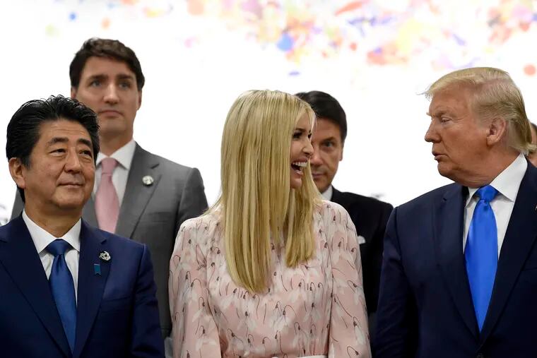 Ivanka Trump, center, talks with her father President Donald Trump, right, after speaking at the G-20 summit event on women's empowerment in Osaka, Japan, Saturday, June 29, 2019. Japanese Prime Minister Shinzo Abe is at left.