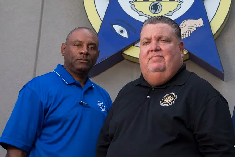 Roosevelt Poplar (left) will serve as the new president of the Fraternal Order of Police Lodge 5. He's pictured here in 2019 alongside his predecessor, John McNesby.