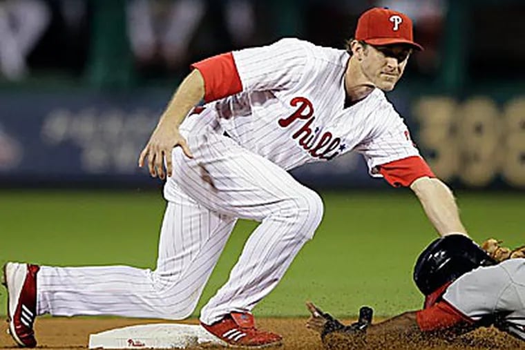 Phillies second baseman Chase Utley will refrain from spending much time reflecting upon what transpired in 2012. (Matt Slocum/AP)