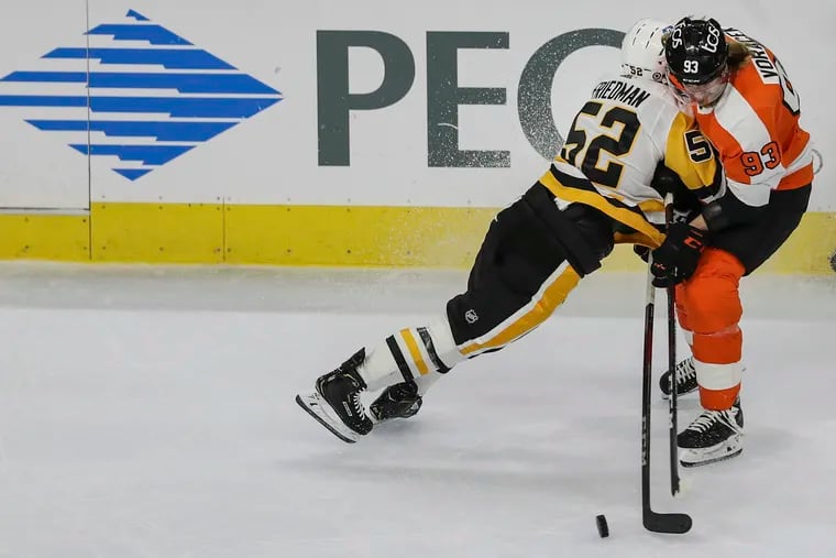 Mark Friedman, shown here laying some wood on Jake Voracek, drew two Flyers penalties (during which the Penguins scored) and had three hits and an empty-net goal in Pittsburgh's 7-3 win Tuesday.
