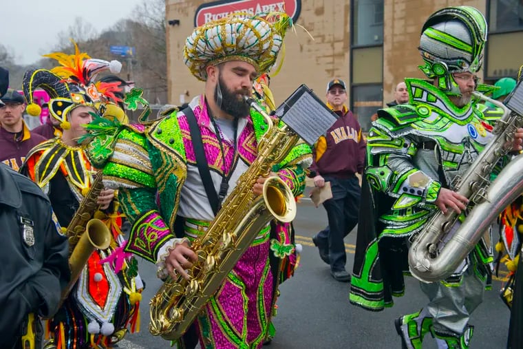 Philadelphia Eagles center Jason Kelce plays his saxophone with the Avalon String Band during the Mummers Parade on Main Street in Manayunk section of Philadelphia, February 25, 2018.  Avi Steinhardt / For the Philadelphia Inquirer 