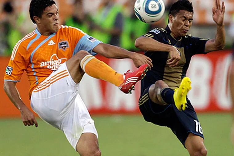 Union's Michael Orozco (16) and Houston Dynamo's Luis Angel Landin, left, battle for the ball during the first half. (AP Photo/David J. Phillip)