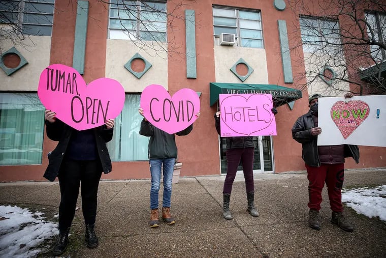 Demonstrators protest outside the home of Tumar Alexander, managing director of Philadelphia, Sunday to demand the reopening of COVID-19 hotels for the city's homeless.