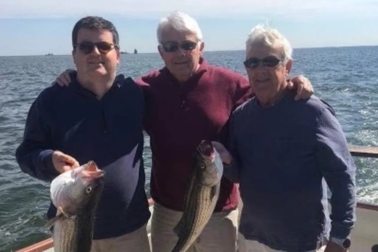 Professor Hrebiniak (center) liked to fish with his son, Justin (left), and brother, Greg.