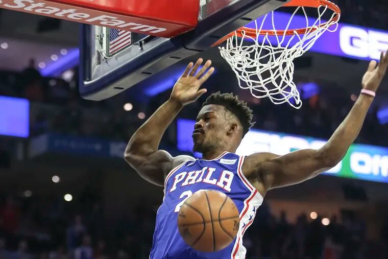 Sixers' Jimmy Butler dunks against the Nets during the 1st  quarter of Game 5 of the first round of the NBA playoffs at the Wells Fargo Center in Philadelphia, Tuesday, April 23, 2019.