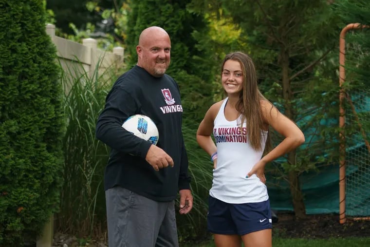 Jamie McGroarty (left), the Eastern girls' soccer coach, and daughter Kelli, the team's star player, have had great success over the last three years.