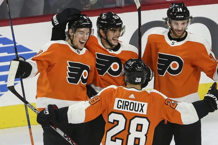 Robert Hagg (center) scored his first NHL goal in the Philadelphia Flyers’ 4-3 win over the Detroit Red Wings at the Wells Fargo Center.