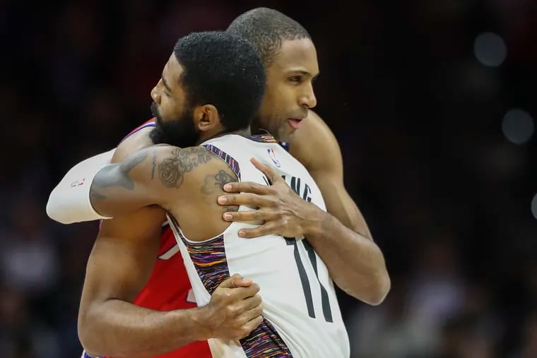 The Sixers' Al Horford embraced former teammate Kyrie Irving (11) of the Brooklyn Nets before Wednesday night's game.