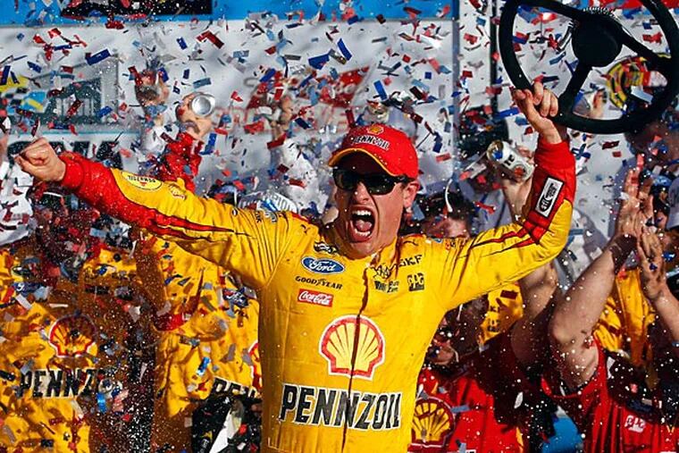 NASCAR Sprint Cup Series driver Joey Logano (22) celebrates winning the Daytona 500 at Daytona International Speedway. (Peter Casey/USA Today)