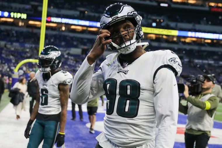 Eagles defensive end Robert Quinn was ruled out of Sunday's game after missing Friday's practice with a knee injury.