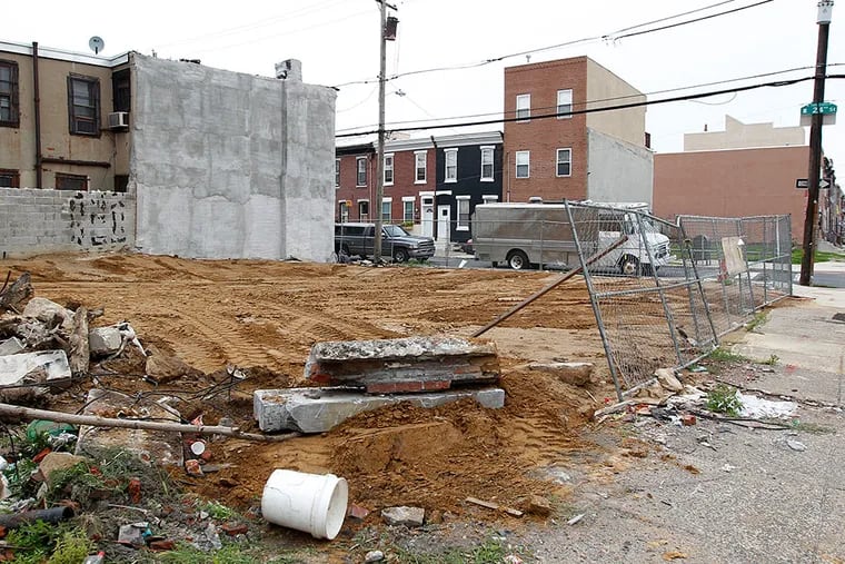 This vacant lot at 24th and Federal Streets in Point Breeze was the site of a building that was demolished in 2014. An inspector said the contractor did not have the required permits. MICHAEL BRYANT / Staff Photographer