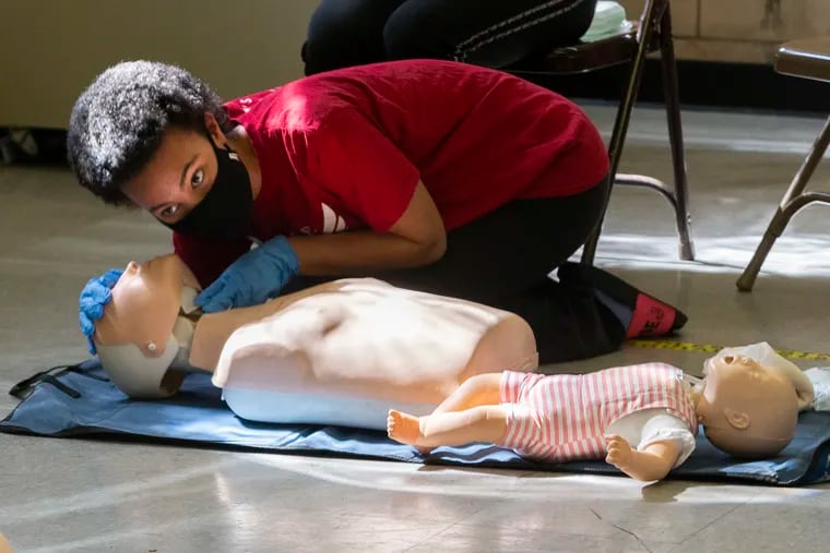 To draw more lifeguards to city pools, the city is covering all application and certifications costs for young people. In this 2021 photo, potential lifeguards  practiced CPR for both infants and adults.
