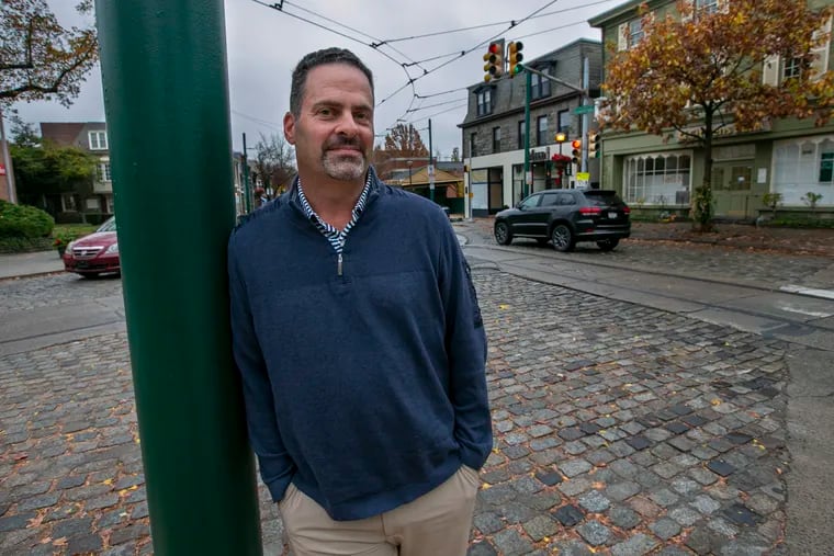 Seth A. Shapiro, a real estate executive who is also chairman of the board that oversees Philadelphia Gas Works, is in line to take over as head of the city-owned gas utility at the end of 2021. He is shown here along Germantown Avenue in Chestnut Hill section of Philadelphia, where he lives.