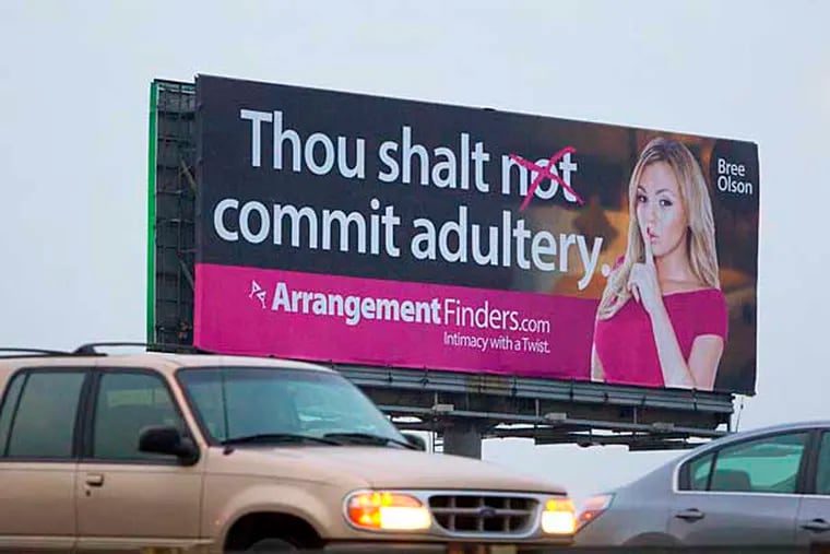Southbound rush hour traffic passes a controversial billboard on the northbound side of I95 at Allegheny Avenue.  ( ED HILLE / Staff Photographer )