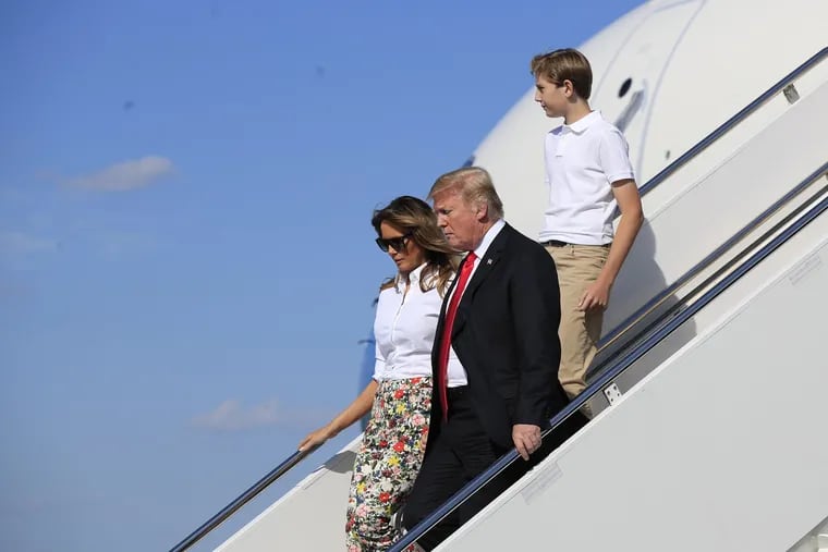 President Donald Trump, first lady Melania Trump and their son Barron Trump, disembark Air Force One upon arrival at Morristown Municipal Airport, in Morristown, N.J., Friday, June 29, 2018.