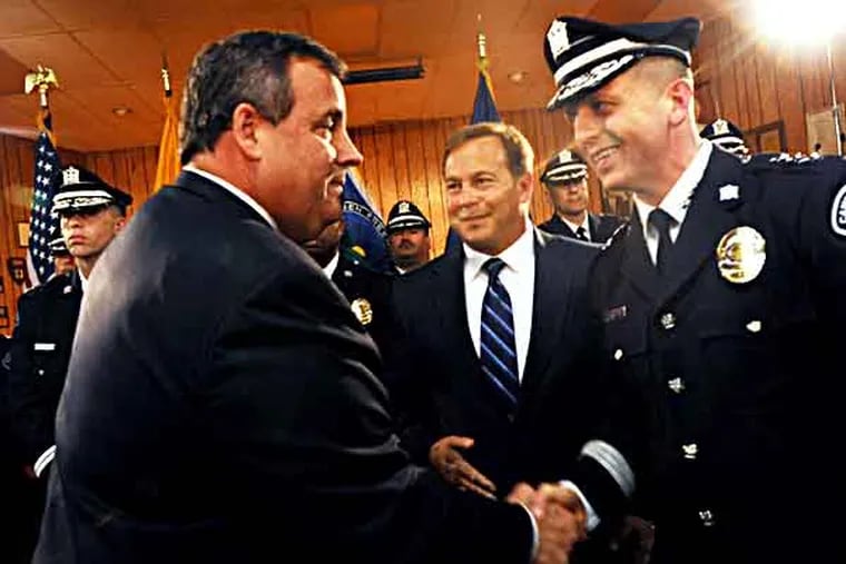At Malandra Hall in Camden, a ceremonial swearing-in for Camden County Police Chief Scott Thomson on 5/1/13.  Afterward, Gov. Chris Christie shakes Thomson's hand.  ( APRIL SAUL / Staff )