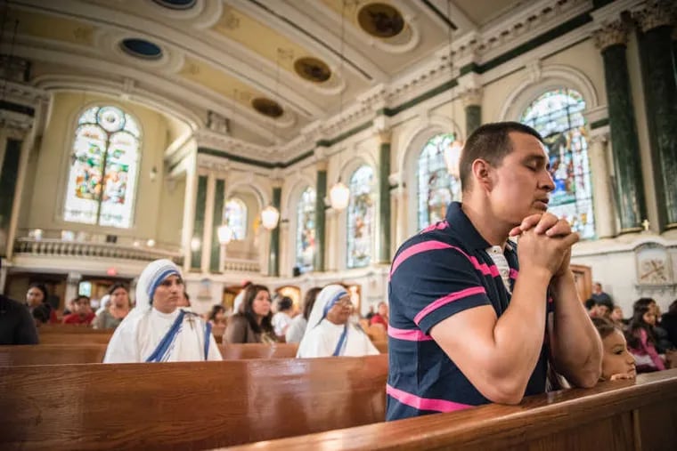 Jose Gomez prays before a special Mass for earthquake and hurricane victims Thursday, Sept. 21, 2017, at St. Patrick Church in Norristown. Gomez has relatives who live outside Mexico City, and they have been reported safe.
