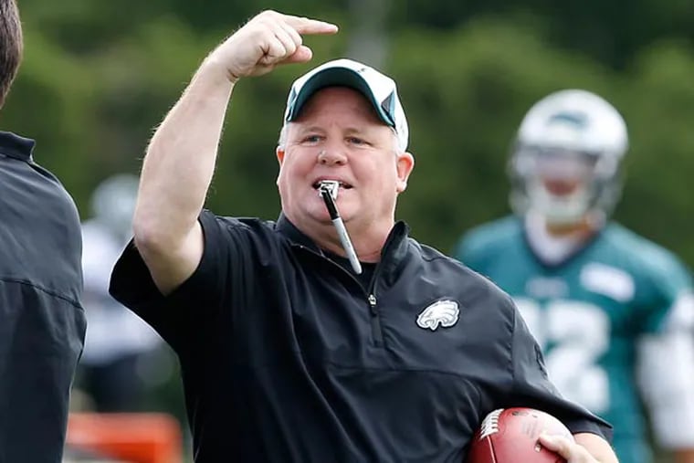 Chip Kelly keeps the players moving as the Eagles held organized team activities at the NovaCare Complex in Philadelphia on May 13, 2013. (David Maialetti/Staff Photographer)