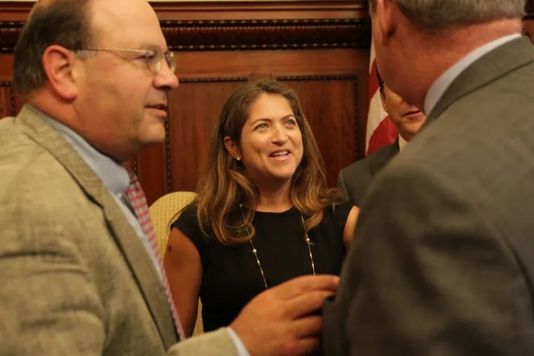 Cynthia Figueroa smiles as she talks with Councilman Allan Domb (left) and Mayor Kenney after she was named new Department of Human Services commissioner in Philadelphia.