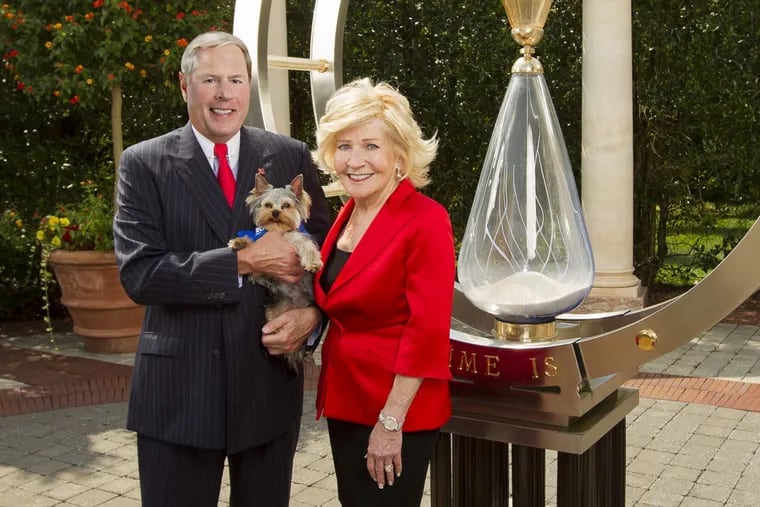 Banker Vernon Hill and his wife designer Shirley Hill, with their dog Duffy, at their Moorestown mansion home, which they call Villa Collina