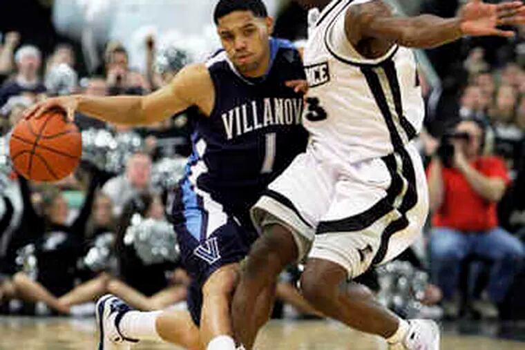 Villanova&#0039;s Scottie Reynolds wards off Providence&#0039;s Brian McKenzie as he brings the ball up the court in the first half. The Wildcats led by 15 at halftime. Last night&#0039;s game ended too late for this edition.