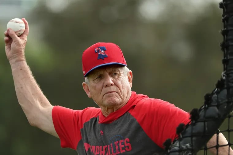 Guest instructor Larry Bowa throws during a batting practice session at Phillies spring training in Clearwater, Fla., on Feb. 14, 2020. He had a hand in both the 1980 and 2008 championships.