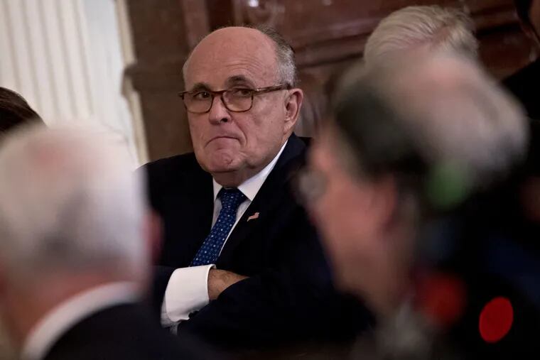 Rudy Giuliani, President Donald Trump's personal lawyer, at the White House in July. On Thursday, Giuliani dialed back a comment that had left open the possibility that members of Trump's 2016 campaign may have conspired with Russia, saying he did not intend to suggest any conspiracy or wrongdoing.