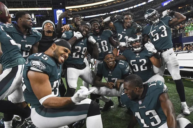 Philadelphia Eagles players mug for the cameras at the end of Sunday night’s 37-9 rout of the Dallas Cowboys at AT&amp;T Stadium in Arlington, Texas.
