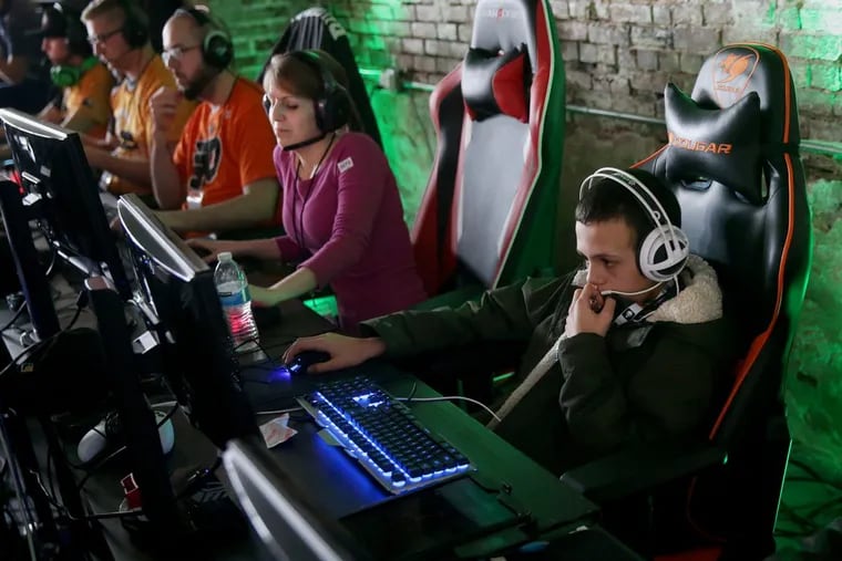 Chase Slay, 13, of Downingtown, far right, awaits the start of a match during the Fusion University “Hometown Hero” competition at N3rd Street Gamers on Feb. 17. Ninety-six Overwatch players competed for the opportunity to join Fusion University, the academy team for Comcast Fusion eSports brand.