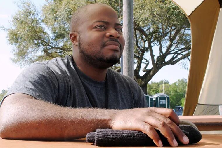 Corwin Cherry , 34, takes online classes through private, for-profit Kaplan University. Cherry, who has PTSD, says the chaotic nature of classrooms would trigger panic attacks. ANTHONY CAVE / News 21