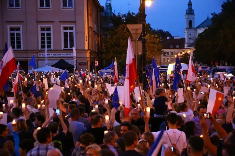 A mass protest against justice reforms in front of the highest court at Krasinskich Square on Saturday, July 22, 2017 in Warsaw, Poland. Protestors lit up masses of candles. (Jakob Ratz/Pacific Press/Zuma Press/TNS)