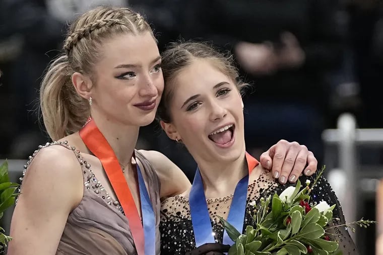 Amber Glenn, left, who won the women's title, and Isabeau Levito, who won in 2023 and took third this time, embrace during the medals ceremony at the 2024 U.S. Figure Skating Championships.