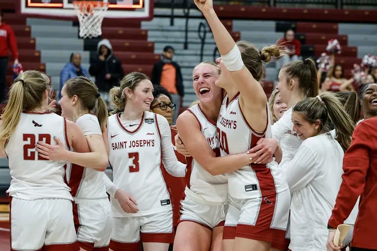 St. Joseph celebrates beating Seton Hall  54-47 advancing to the second round of the WBIT tournament at the The Hagan Arena In Philadelphia, Thursday, March 21, 2024.