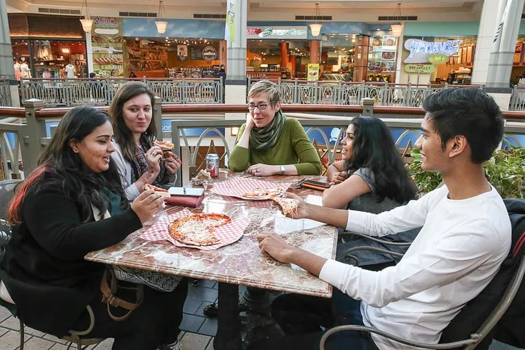 Pizza at the King of Prussia Mall is an intercultural fest for (from left) Keya Diwanji of Mumbai; Amara O'Connell; Arcadia University's Sandra Crenshaw; and Shruti Iyer and Suvin Seal of Mumbai. Arcadia students and Indian counterparts exchanged visits, and explored food and its cultural and social meanings.
