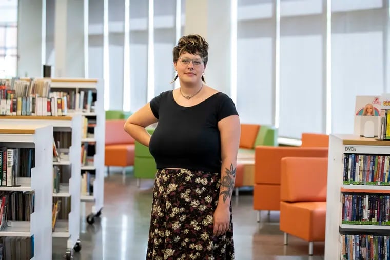 Librarian Rachel Hludzinski poses for a portrait at the South Philadelphia Library. Many departments, like the Free Library, are understaffed.