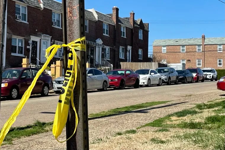 Police tape is left over from Friday night’s shooting that left an 11-year-old dead and a 14-year-old in critical condition on the 1500 block of McKinley Street in Philadelphia.