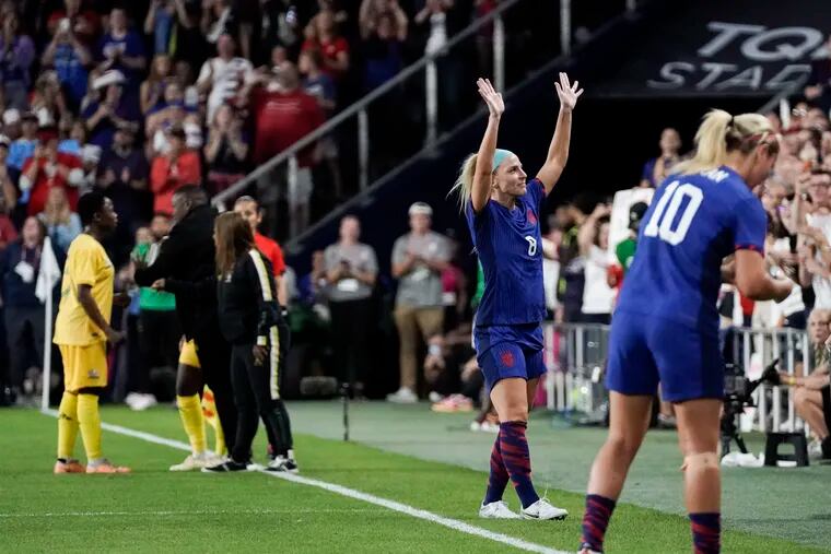 Julie Ertz waves to the crowd after being subbed out of her final soccer game late in the first half.