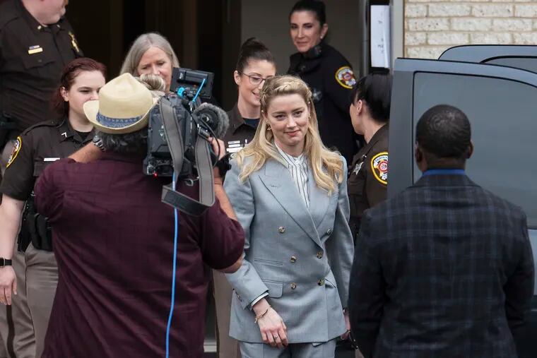 Actress Amber Heard departs the Fairfax County Courthouse Friday in Fairfax, Va.