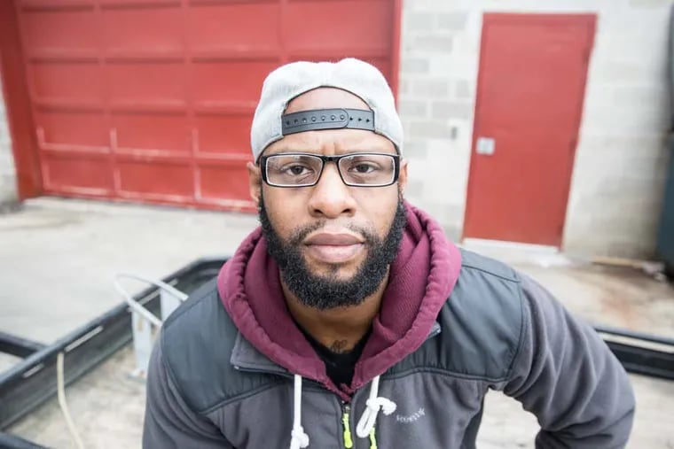 Brandon Ruff poses for a portrait outside of Sunday Breakfast Rescue Mission, where he just finished dropping off a truckload of food donations on December 21, 2014. (Colin Kerrigan / Philly.com)