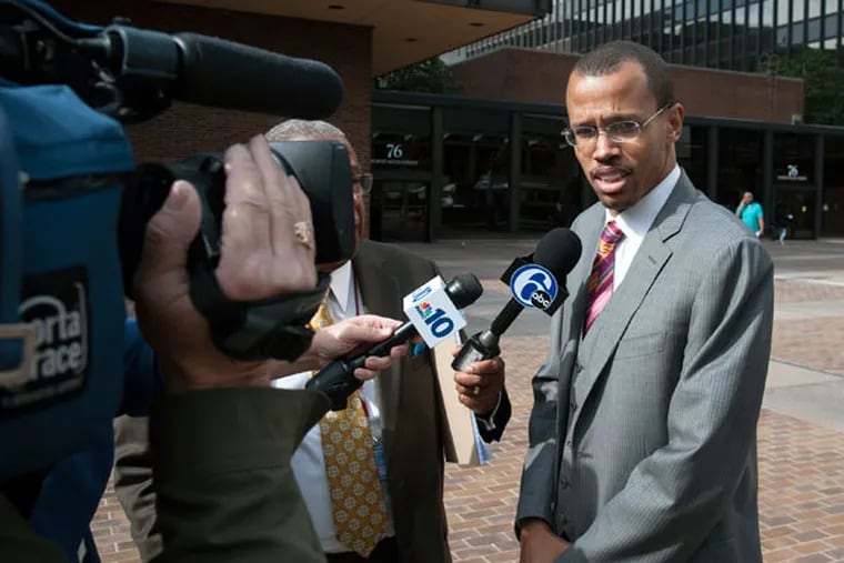 Chaka "Chip" Fattah Jr. talks with the press outside the federal courthouse during a lunch break Oct. 29, 2015.