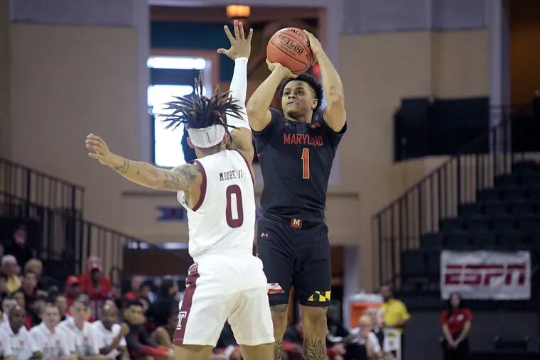 Maryland guard Anthony Cowan Jr. (1) goes up for a shot in front of Temple guard Alani Moore II (0) during the first half of the Owls' loss to the No. 5 Terrapins Thursday in Orlando.