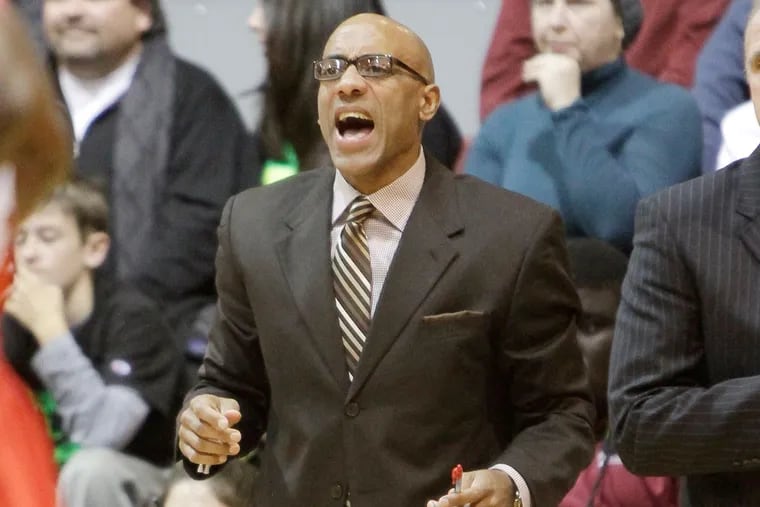 St. Joseph's assistant coach Geoff Arnold yells instructions during a St. Joseph's game in November 2013.