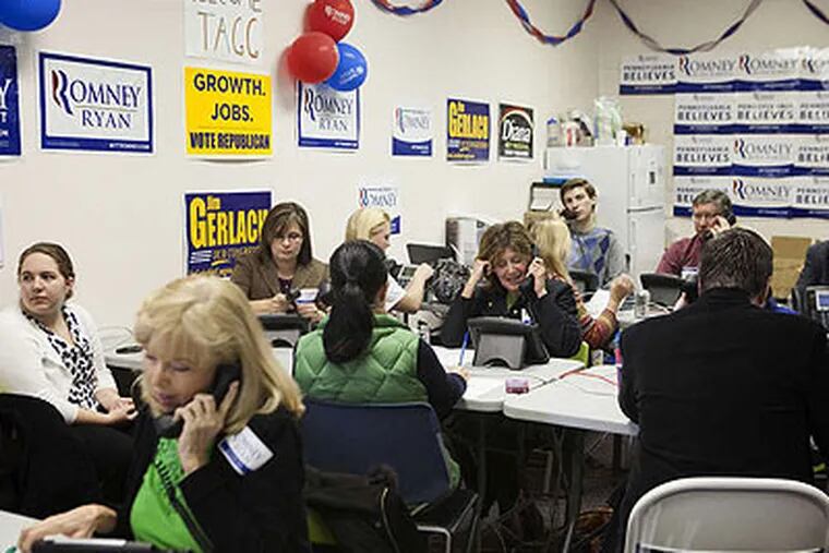 At a Romney campaign office in Paoli, Lori Hamilton (foreground) and other Romney supporters at work. (Ed Hille / Staff Photographer)