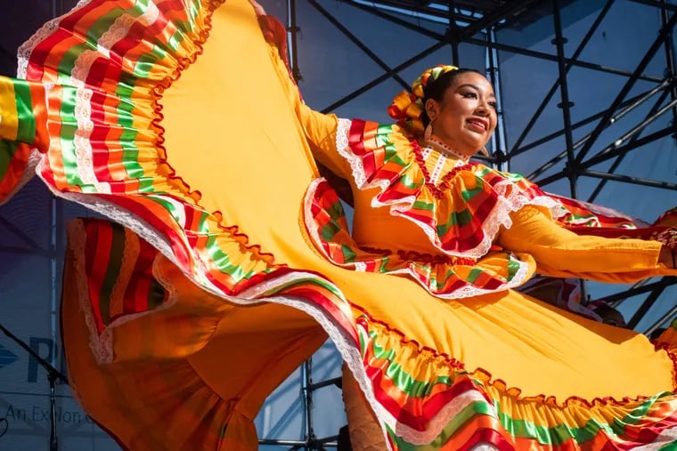 Laura Rios, of Norristown, PA, performs the traditional Mexican dance folklórico with the Folklórico Yaretzi dance company at the Mexican Independence Day Festival at Penn's Landing on September 16, 2018.