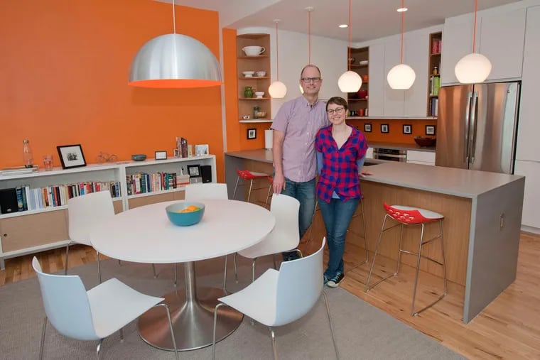 Andrea Monroe and her husband, Craig Green, show off the kitchen/dining area of their condo in the Lenox building.