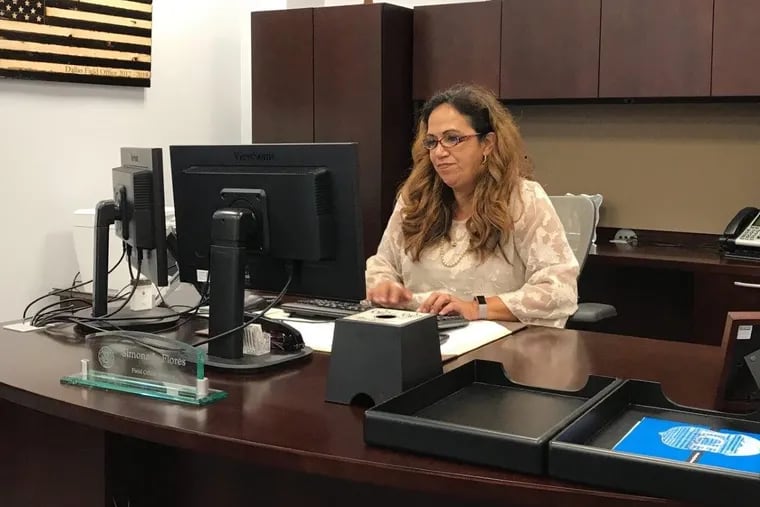 ICE Enforcement and Removal Operations Philadelphia Field Office Director Simona L. Flores at her desk in Center City
