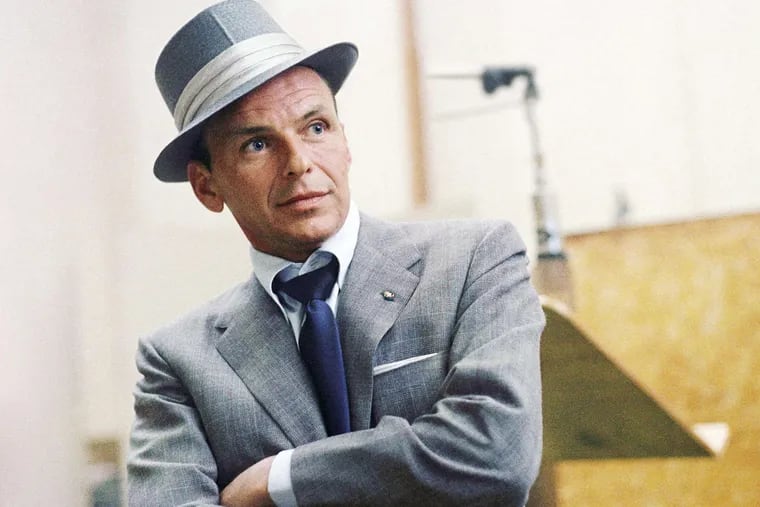 Frank Sinatra at a Capitol Records recording session in  Los Angeles, CA.  1954.