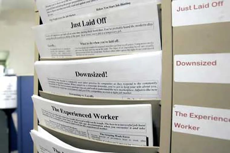 A rack with forms to assist the unemployed and job seekers is seen at a New York State Department of Labor career center in Albany, N.Y. The government says new claims for unemployment benefits reached their highest level in 26 years last week, as companies cut workers at a rapid pace. (Mike Groll/AP Photo, File)